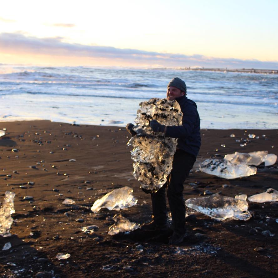 Brian in  Iceland holding a huge block of ice