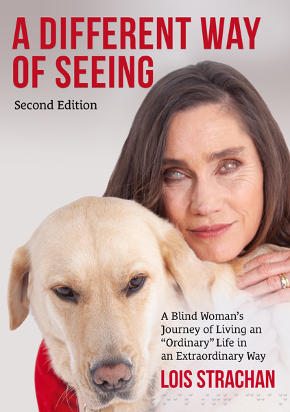 Cover of the book A Different Way of Seeing, with a dark-haired woman wearing a red dress and crouching to hug a Yellow Labrador