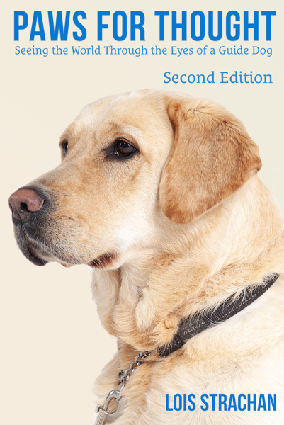 The cover of the book Paws for Thought (second edition) by Lois Strachan, written in blue on a cream background. The focus of the image is the head of a yellow Labrador who is wearing a guide dog harness.